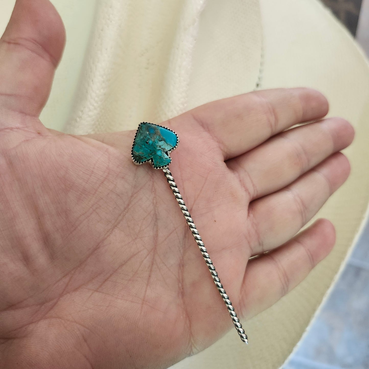Pique à chapeau en turquoise
